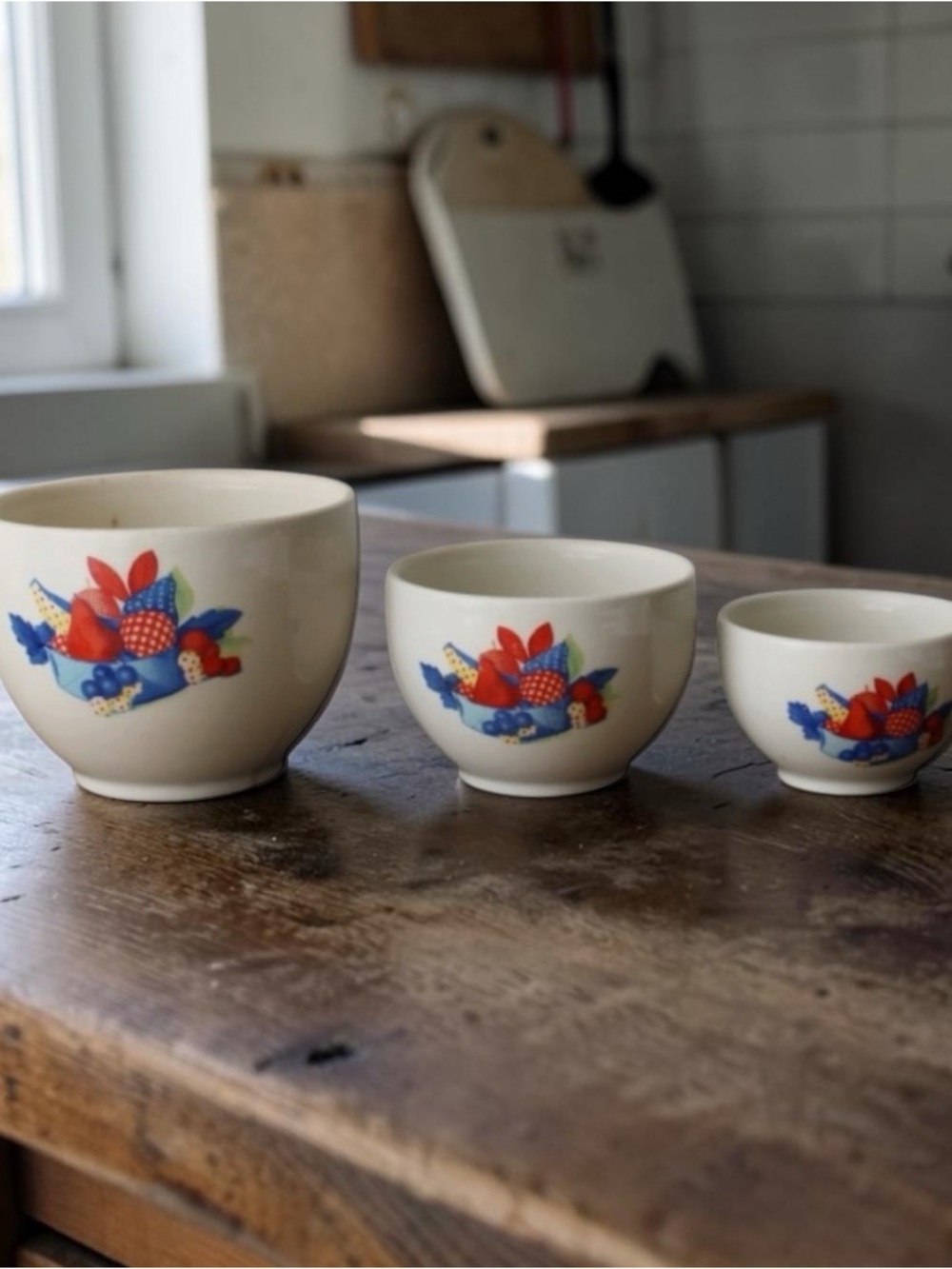 Vintage 40s Depression era ironstone mixing bowls in the Calico Fruit pattern,